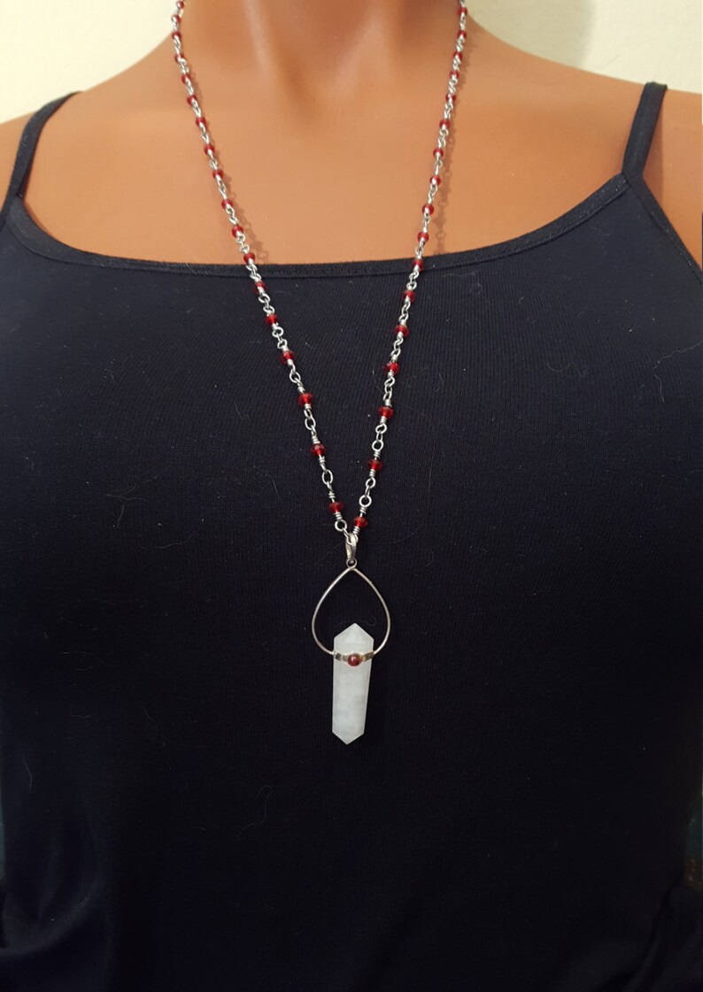 light rose clouded quartz crystal set with sterling silver tear drop and garnet with red crystal and sterling silver wire wrap chain