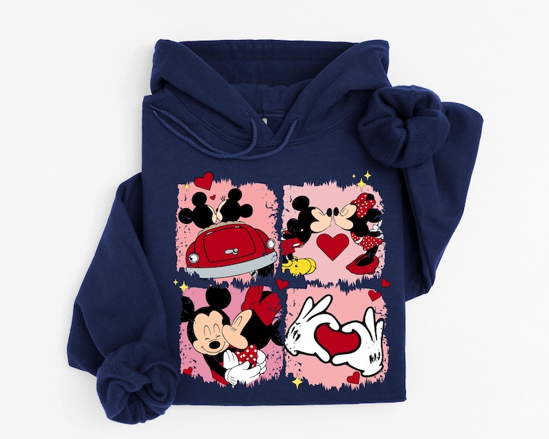May include: Navy blue hoodie with a graphic of Mickey and Minnie Mouse in romantic scenes. The design includes hearts, a red car, and a heart-shaped hand gesture, set against a pink background.