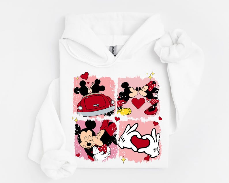 May include: White hoodie with a four-panel design featuring Mickey and Minnie Mouse. The panels show the couple in romantic poses, with hearts and a red car. The design includes a heart-shaped hand gesture.