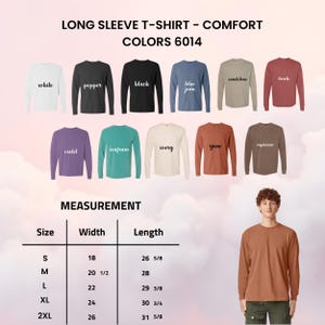 May include: A selection of long-sleeved t-shirts in colours such as white, black, and blue. A size chart shows measurements in inches, with the smallest size having a width of 18 inches and a length of 26 5/8 inches. The text reads "LONG SLEEVE T-SHIRT - COMFORT COLORS 6014."