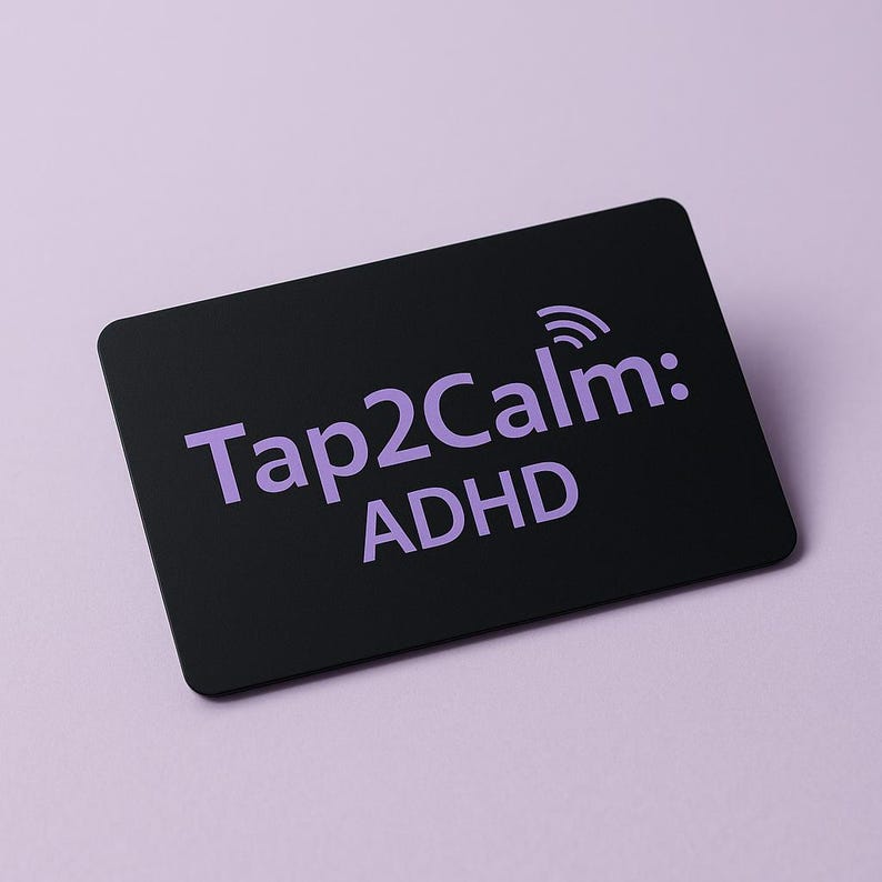 May include: A black rectangular card with rounded corners. The card features the text "Tap2Calm: ADHD" in a light purple color, along with a small wireless signal icon. The background is a solid light purple.