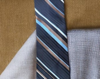 Corbata vintage Givenchy a rayas marrones y plateadas.