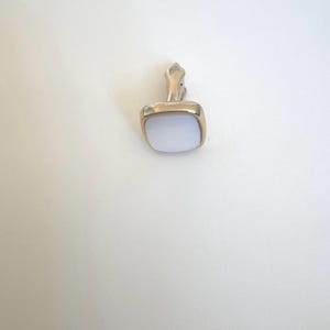 May include: A set of three ceramic mugs with a speckled, matte finish. The mugs are in shades of cream, light gray, and dark gray. Each mug has a simple, minimalist design, perfect for coffee or tea.