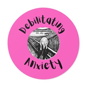 May include: Pink round sticker with a black and white image of "The Scream" painting by Edvard Munch. The text "Debilitating Anxiety" is written in black around the image.