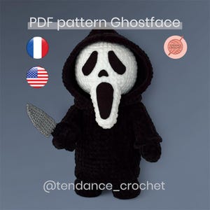 May include: A handmade Ghostface doll, featuring a white mask with black eye and mouth details, and a black hooded robe. The doll holds a gray crocheted knife. Text on the image reads "PDF pattern Ghostface" and "@tendance_crochet".