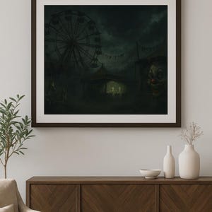 May include: A framed print depicting a spooky carnival scene under a dark, cloudy sky. A Ferris wheel, a tent, and a clown face are visible. The artwork has a dark, eerie atmosphere, with muted colors and a sense of foreboding.