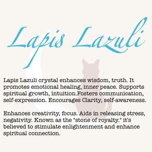 May include: A cream-coloured graphic featuring the words "Lapis Lazuli" in light blue script. The text below details the crystal's properties, including enhancing wisdom, emotional healing, and creativity. A cat silhouette is in the background.