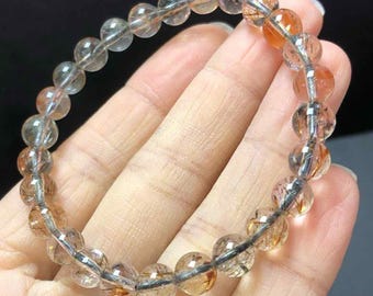 スーパーセブンクリスタルブレスレット：ブラックゴールデンビーズ