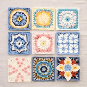 May include: Nine colorful crochet squares in various designs. Each square features a unique pattern, including floral and geometric motifs, in shades of blue, yellow, pink, and white. The squares are arranged in a grid, showcasing the handmade craftsmanship.