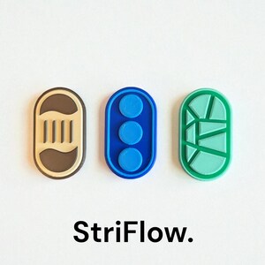 Puede incluir: Tres objetos ovalados y coloridos. Uno es beige y marrón con líneas verticales, el segundo es azul con tres círculos y el tercero es verde con un diseño geométrico. La palabra "StriFlow" está escrita debajo.