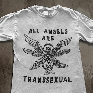 May include: A set of three ceramic mugs with a speckled, matte finish. Each mug features a different color: light blue, cream, and gray. The mugs have a simple, modern design and a comfortable handle.