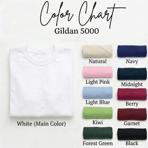 May include: A white Gildan 5000 t-shirt next to a color chart. The chart displays rolled fabric samples in various colors, including natural, light pink, light blue, kiwi, forest green, navy, midnight, berry, garnet, and black.