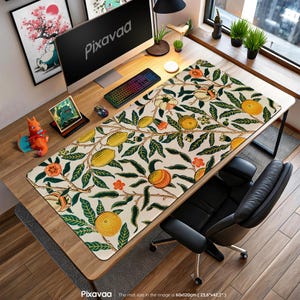 May include: A desk mat with a botanical pattern of lemons, oranges, and green leaves on a cream background. The rectangular mat measures 60 x 120cm. The text "Pixavaa" is visible on the mat.