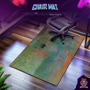 May include: Rectangular chair mat with an abstract design in shades of green, orange, and brown. The mat is placed on a wooden floor, with a black and gray office chair on top. The text "CHAIR MAT" is displayed at the top.