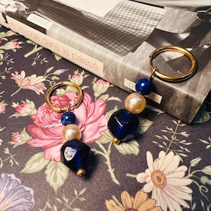 Vintage earrings adorned with upcycled pearly and blue beads and Lapis Lazuli
