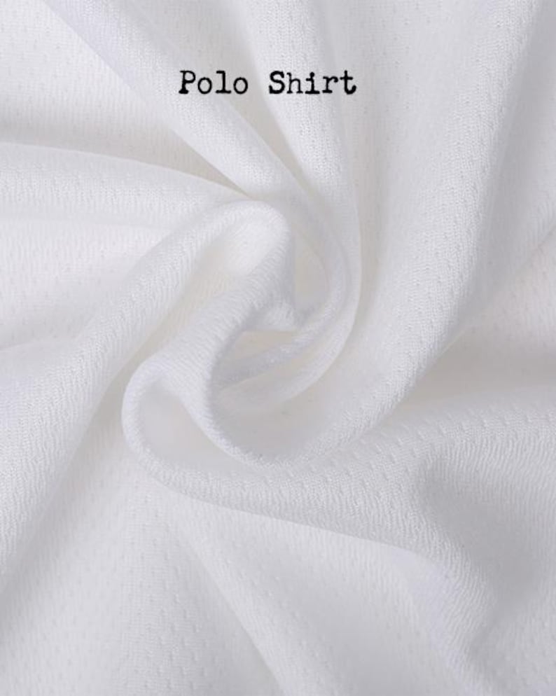 May include: A white polo shirt fabric with a visible mesh texture and small perforations throughout the material. The words Polo Shirt are printed in a black, typewriter-style font near the top center of the image, showing folds and drapes.
