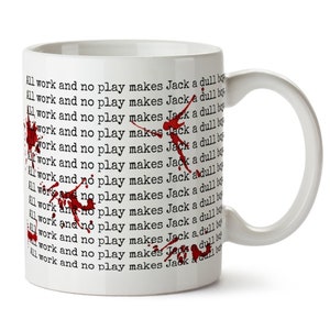 May include: White ceramic mug with a red splatter pattern. The mug has the text "All work and no play makes Jack a dull boy" repeated multiple times.