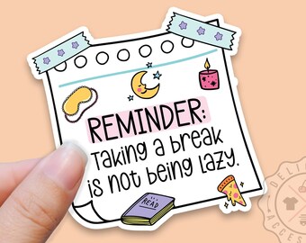 May include: A white sticker with a pink reminder note that says "REMINDER: Taking a break is not being lazy." The sticker has a blue tape border with purple stars and includes illustrations of a sleep mask, a crescent moon, a candle, a book, and a slice of pizza.