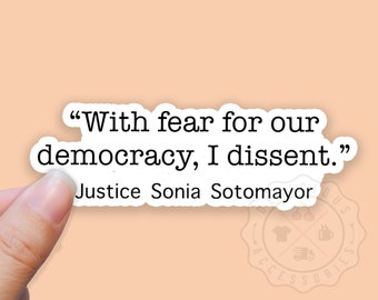 May include: White sticker with black text that reads "With fear for our democracy, I dissent."  The text is attributed to Justice Sonia Sotomayor.