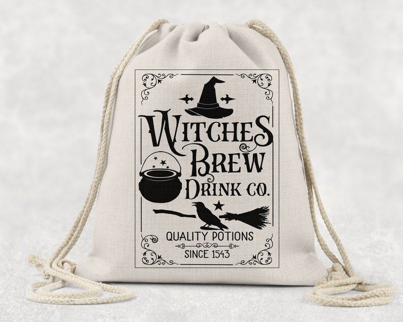 May include: A beige drawstring bag with a black graphic design. The design features the text "Witches Brew Drink Co." with a witch's hat, cauldron, broom, and raven. The text "Quality Potions Since 1543" is also included.