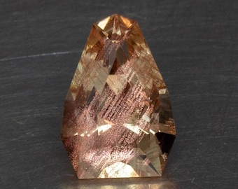 Natural Untreated Oregon Sunstone With Copper Schiller Precision Cut into a Handmade Faceted Modern Shield Cut Gemstone