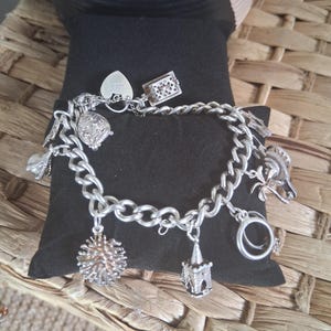 Sterling silver charm bracelet with 10 charms