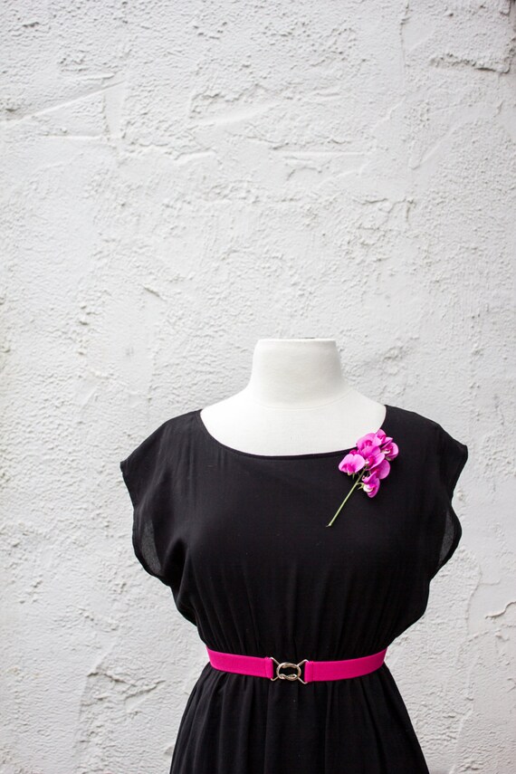 black dress with pink belt