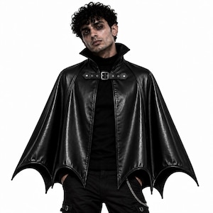 Gothic vampire batwing cape worn by man, black leather cape with high collar and front buckle for Halloween cosplay