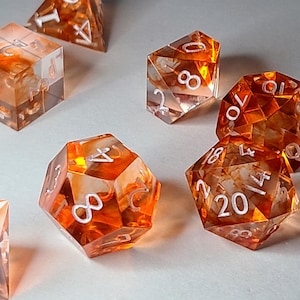 Citrus Mist Dice Set – Clear Orange Swirl Resin Dice with White Numbers | Handmade DnD Dice Set for Dungeons & Dragons, TTRPG, RPG Gifts