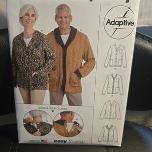 May include: A Simplicity S9488 sewing pattern envelope for adaptive cardigans in sizes XS-XL. The front displays two models wearing different cardigan styles, technical line drawings, and circular insets showing hook and loop closures.