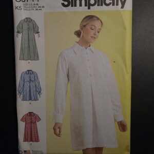 May include: Simplicity sewing pattern S9744, featuring a woman in a white dress. The pattern includes illustrations of three dress styles. The pattern size is U.S. 8-16.