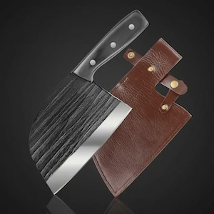 May include: A black and silver cleaver with a textured blade and a black handle with three silver rivets. The cleaver is paired with a brown leather sheath with brass-colored snaps. The blade is approximately 6 inches long.