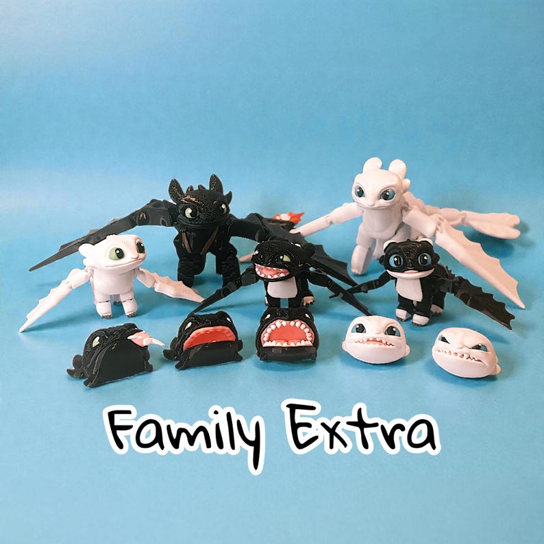 May include: A collection of dragon figurines in black and white, with articulated wings and various facial expressions. The text "Family Extra" is displayed in a playful font on a blue background.