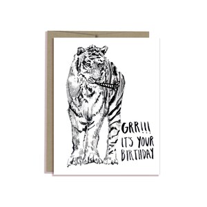 May include: Black and white illustration of a tiger with a party popper in its mouth. The text "GRR!!! It's your birthday" is below the tiger.