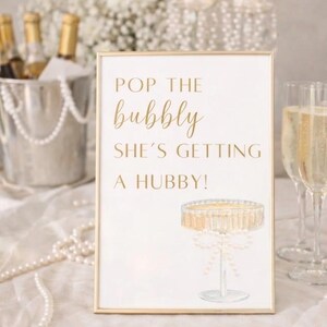 ¡Abre la botella de champán! ¡Ya va a tener marido! Letrero/decoración para baby shower.