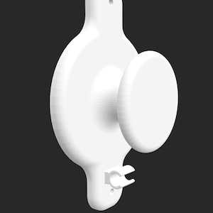 May include: A white, 3D-rendered object with a circular body, a protruding disc, and a handle-like extension. The design includes a small, curved feature at the bottom. The object is set against a dark background.