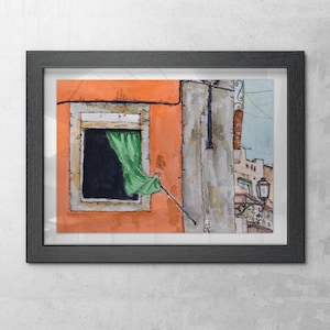 May include: A framed watercolor painting depicting an orange building facade with a dark window opening. A green curtain hangs from the window, and a black metal street lamp is attached to the adjacent gray wall. The artwork features ink outlines.