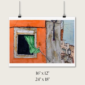 May include: A watercolor painting depicting an orange building facade with a window featuring a green curtain blowing in the breeze. The artwork includes a gray wall section, a street lamp, and text indicating dimensions of 16 inches by 12 inches and 24 inches by 18 inches.