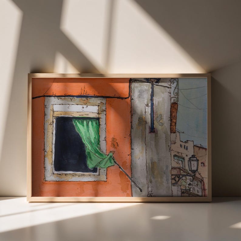 May include: A framed watercolor painting depicting an orange building facade with a dark window and a green curtain blowing outward. The scene includes a gray wall section, a street lamp, and architectural details rendered in ink and watercolor.