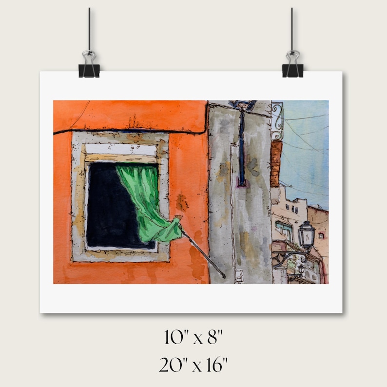 May include: A watercolor painting of an orange building facade with a window featuring a green curtain. The scene includes a gray wall section, a black street lamp, and architectural details. Text below indicates dimensions of 10 inches by 8 inches and 20 inches by 16 inches.