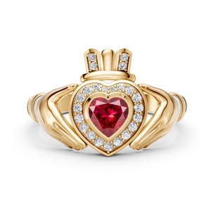 May include: A gold Claddagh ring featuring a central heart-shaped red gemstone surrounded by a halo of small white round-cut diamonds. The ring design includes two hands holding the heart, topped with a crown adorned with small diamonds.