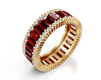 May include: A gold ring with a continuous band of rectangular, deep red gemstones. The ring is accented with small, round, clear gemstones and has a textured gold band. The ring is a piece of jewellery.