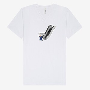 May include: White V-neck t-shirt featuring a cartoon illustration of a person in a blue suit falling down an escalator. The speech bubble says "UPPIES!!!". The shirt is made of a soft material.