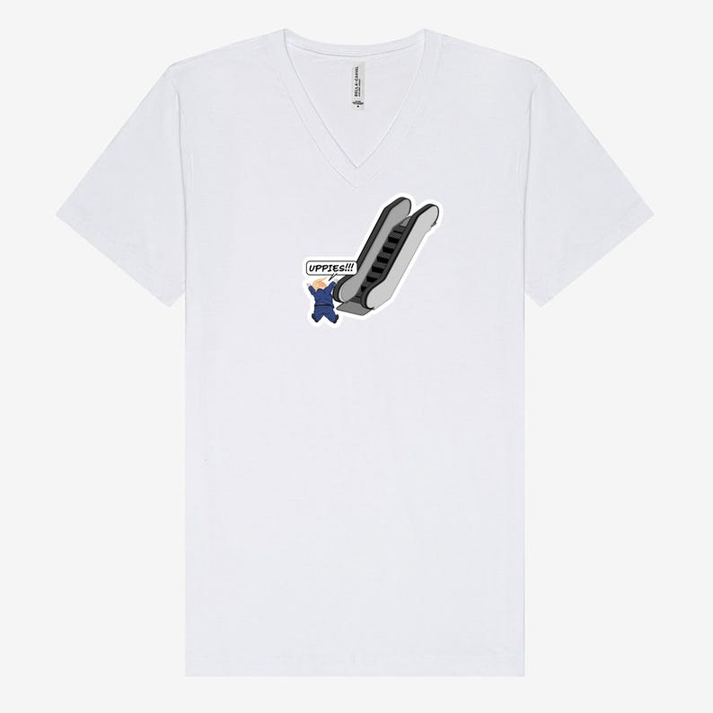 May include: White V-neck t-shirt featuring a cartoon illustration of a person in a blue suit falling down an escalator. The speech bubble says "UPPIES!!!". The shirt is made of a soft material.