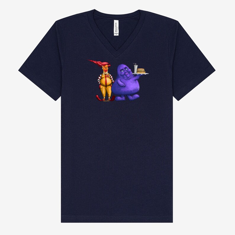 May include: Navy blue V-neck t-shirt featuring a cartoon illustration of two characters. One character is yellow with red hair and the other is purple and holding a tray of food. The t-shirt is made of a soft material.