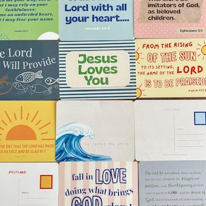 May include: A collection of twelve rectangular postcards featuring various religious quotes and illustrations. Designs include text such as Trust in the Lord, Jesus Loves You, and From the Rising of the Sun, alongside graphics of a sun, a wave, and fish.