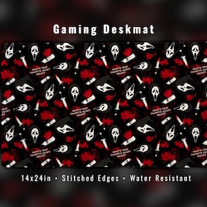 May include: Black gaming deskmat with a repeating pattern of white Ghostface masks, knives, and red splatters. The text "WHAT'S YOUR FAVORITE SCARY MOVIE?" is also featured. The deskmat measures 14x24 inches and has stitched edges.