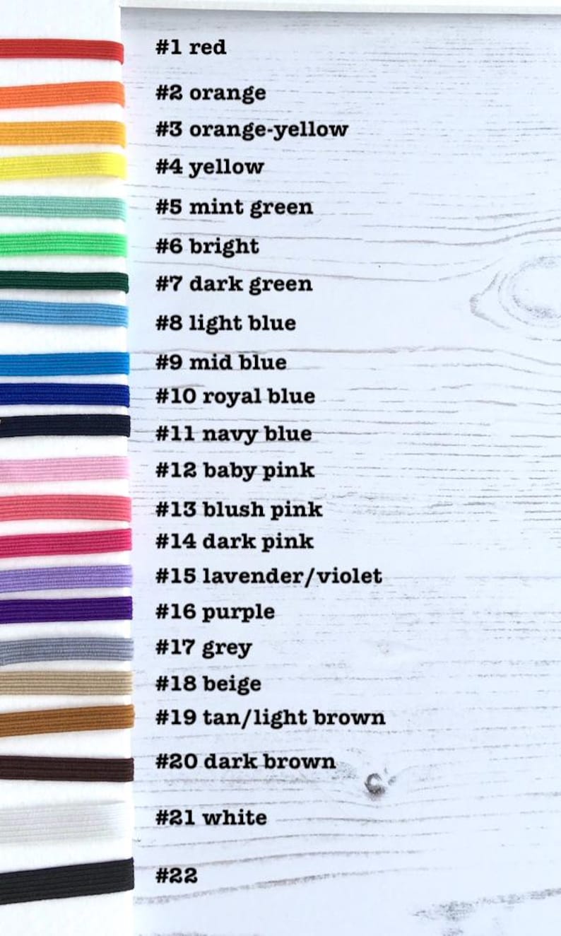May include: A chart with 22 different colored elastic bands, each labeled with a number and a color name. The colors include red, orange, yellow, green, blue, pink, purple, grey, beige, brown, and white.