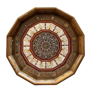 Elevate your serving experience with our handcrafted mother-of-pearl trays. Each piece is made from high-quality wood and features intricate