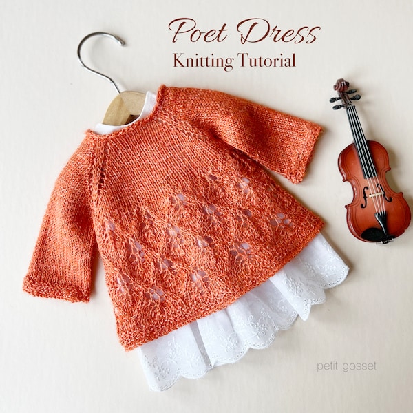 May include: A knitted orange dress with a lace pattern, hanging on a wooden hanger. The dress is styled with a white lace underskirt. The text "Poet Dress Knitting Tutorial" is written above the dress. The text "petit gosset" is written below the dress.